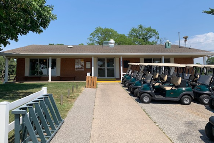 view of clubhouse with golf carts